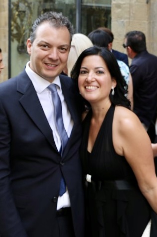 Rose and her husband at a wedding in Arezzo, dressed in formal wear.